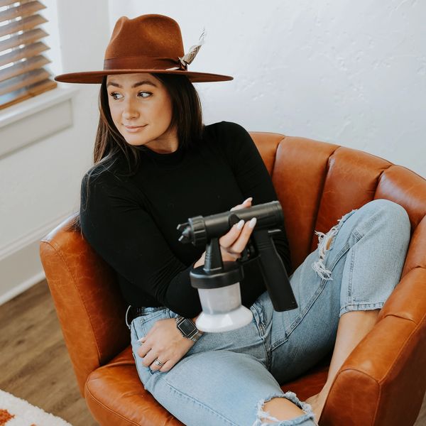 A Woman Wearing a Hat and Jeans