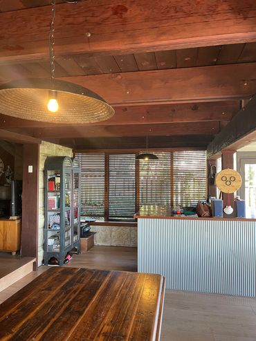 Cozy rustic room with wooden furniture and warm lighting.