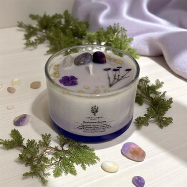 Cashmere Cream candle in a 4 oz glass jar, adorned with crystals and dried botanicals
