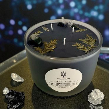 24 oz Black Obsidian Reserve candle with pressed fern leaves, clear quartz, and black obsidian.