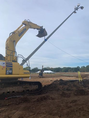 Setting 70’ prestressed concrete poles for stadium lighting