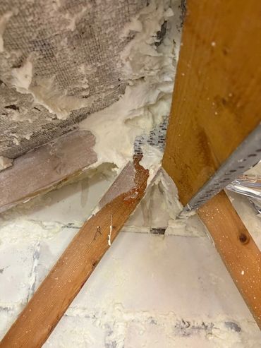 spray foam insulation left in loft and hidden beneath the foil blanket - customer completely scammed
