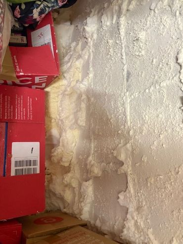 spray foam hidden behind boxes and company claimed they had removed all the foam..... shocking