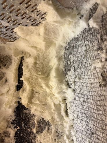 more spray foam hidden under foil blanket