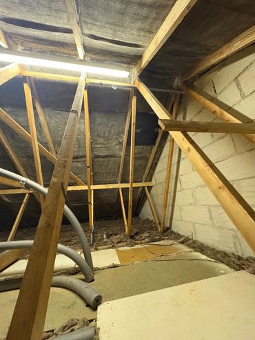 Loft space completely cleared and felt, timbers and gable ends back to original condition, great job