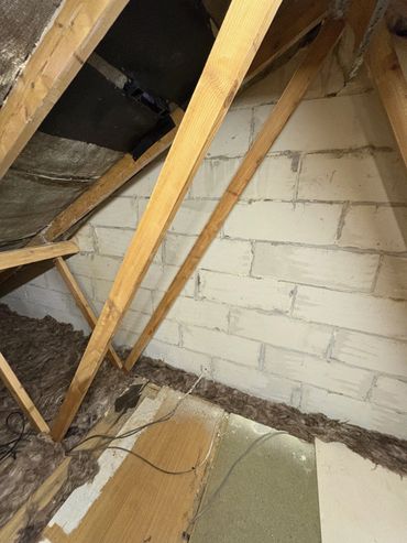 Gable end, timbers and bitumen felt clear and free from spray foam insulation