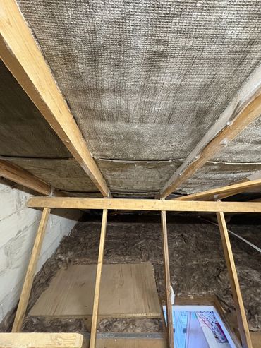 timbers and bitumen felt cleaned and free from spray foam