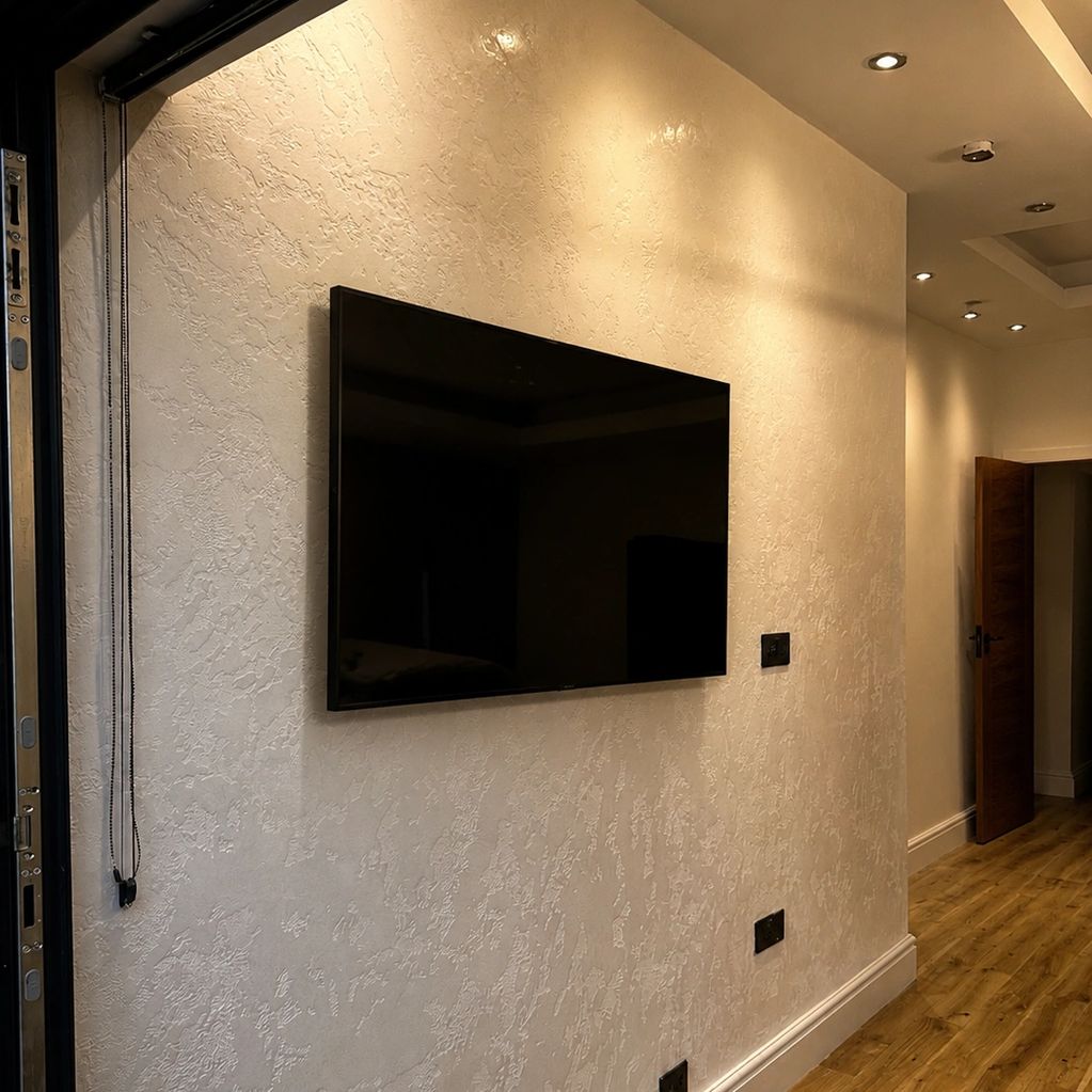 Modern hallway with a mounted flat-screen TV.
