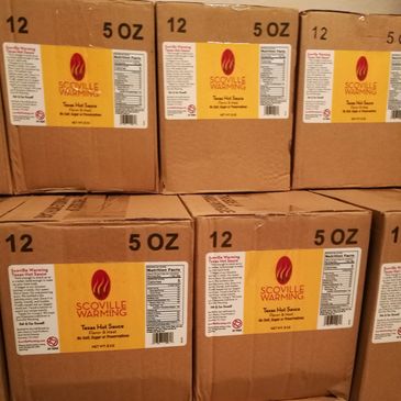 Cases of Scoville Warming Texas Hot Sauce ready to ship
