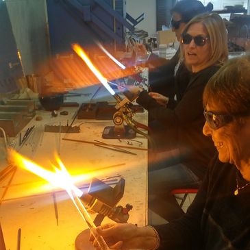 Students working in a lampworking class at the Rising Phoenix Gallery in Michigan City, IN. 