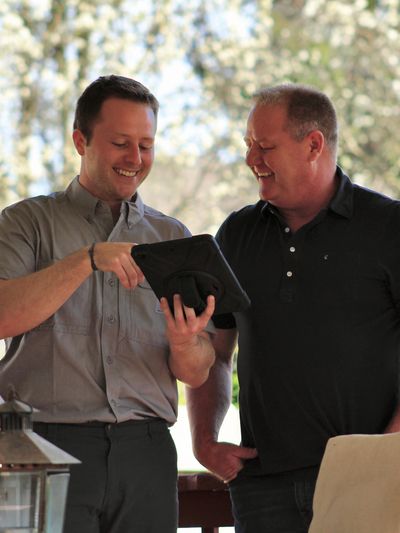 Cooper Powell of Powell Pest And Lawn speaking to a customer