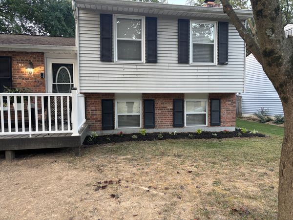 Finished deck with composite handrail. Also finished mulch beds and planted flowers to dress the ho