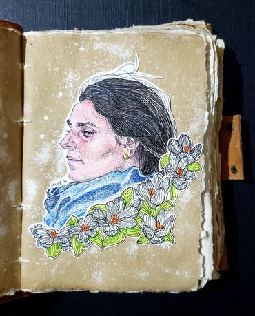 A portrait of Palestinian Journalist Hind Khoudary with flowers.