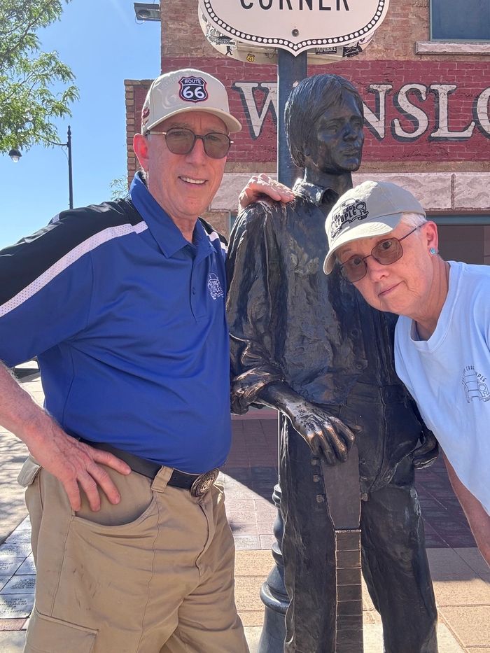 Nick & Norma King stand by the Jackson Browne statue "Take it Easy" in Winslow, Arizona.