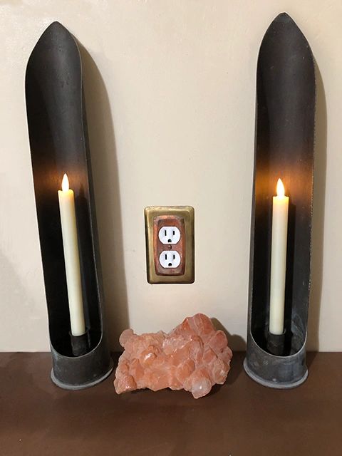 Candle holders made from brass artillery shells.