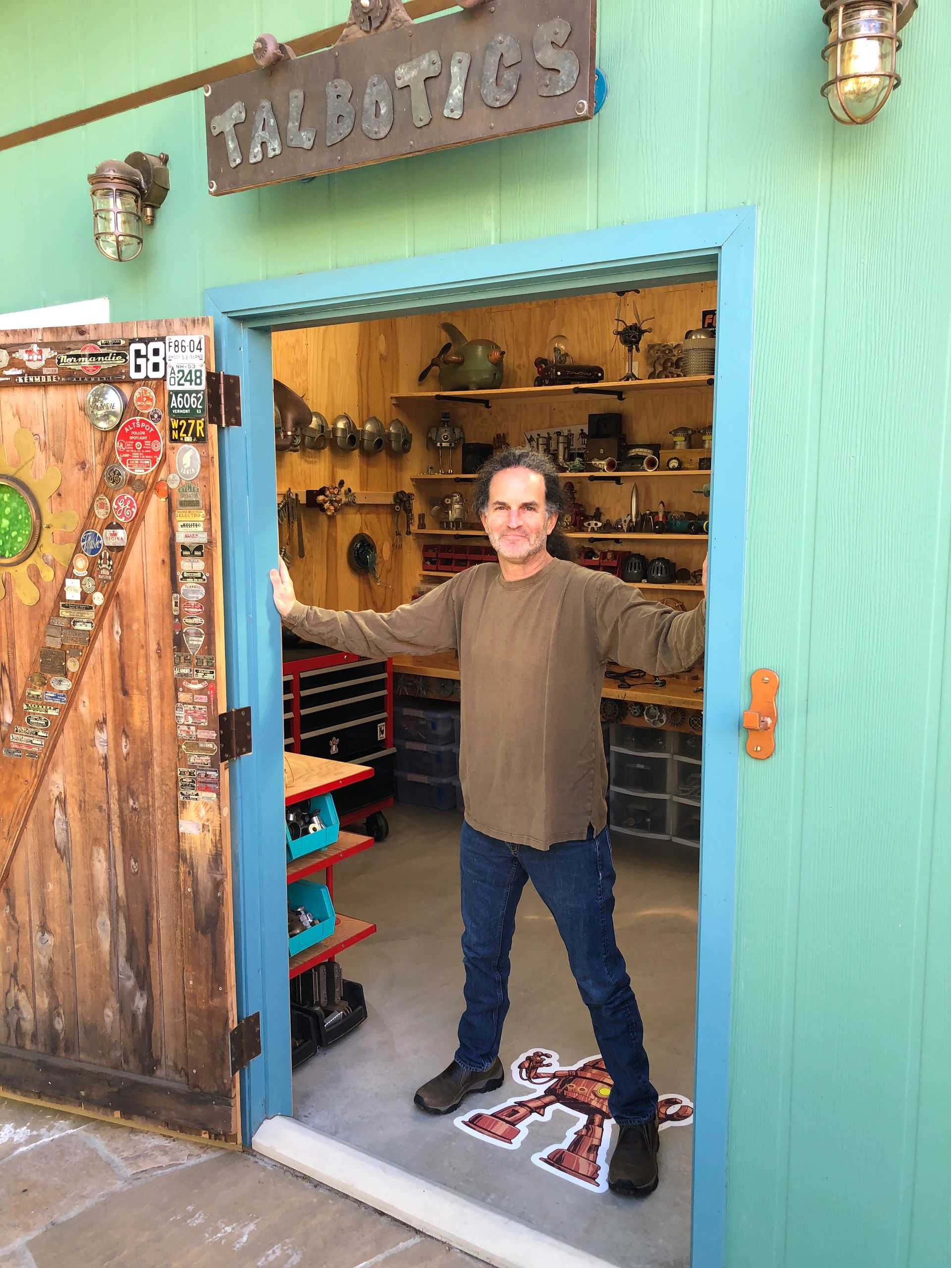 Artist Tal Avitzur standing at the entrance to his Santa Barbara studio.
