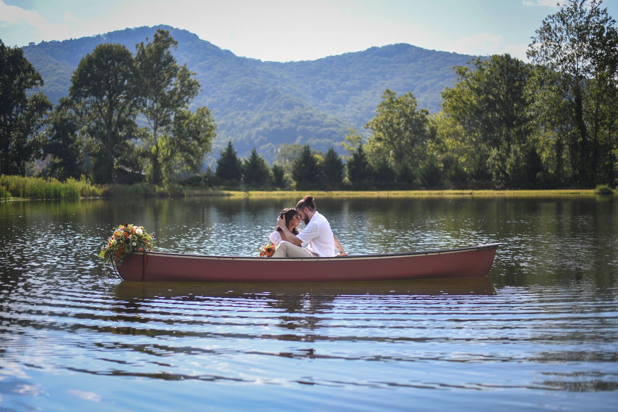 Newly engaged couple on the water in the Blue Ridge Mountains