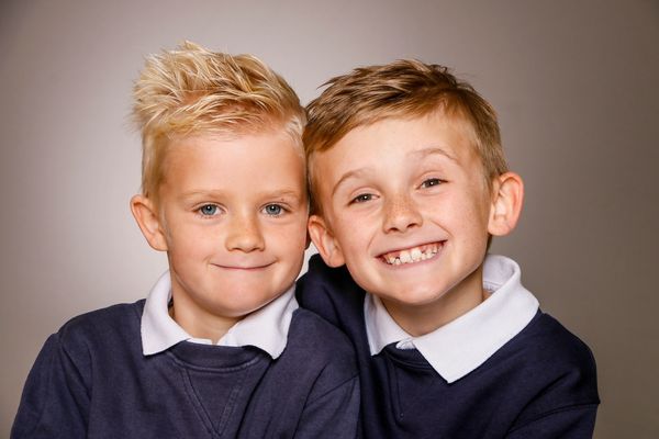 Two brothers smiling at camera