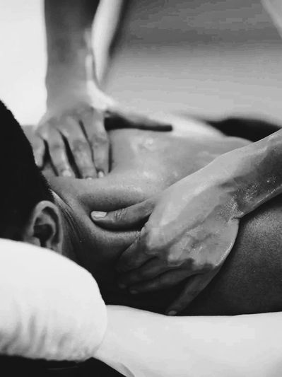 Close-up of a person receiving a relaxing back massage.
