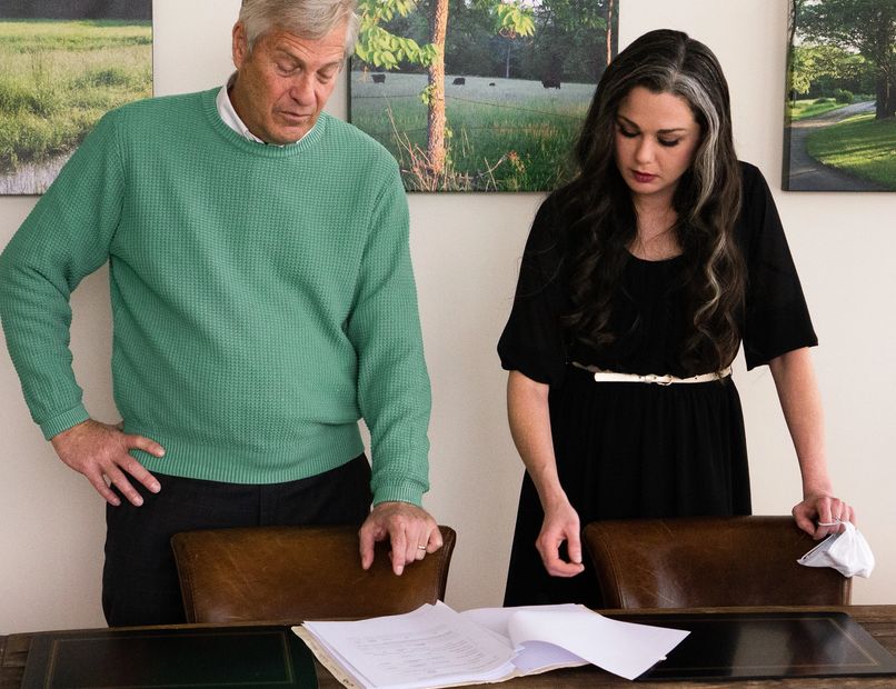 Greg Kincaid and his paralegal, Kristi, review paperwork at Sensible Separations.