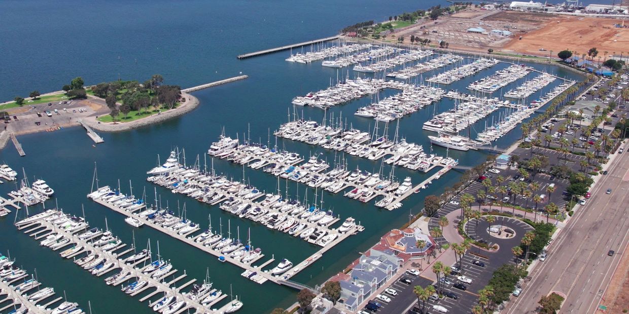 Aerial view of a marina filled with numerous docked boats and yachts.