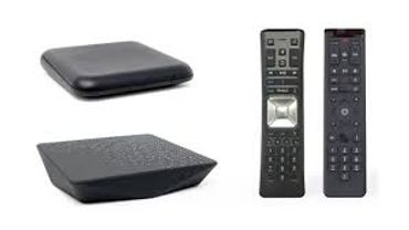 Two black media streaming devices with two remote controls.
