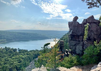 Devils Lake in Wisconsin. The lake is being looked down from the hill, which has a rock monument.