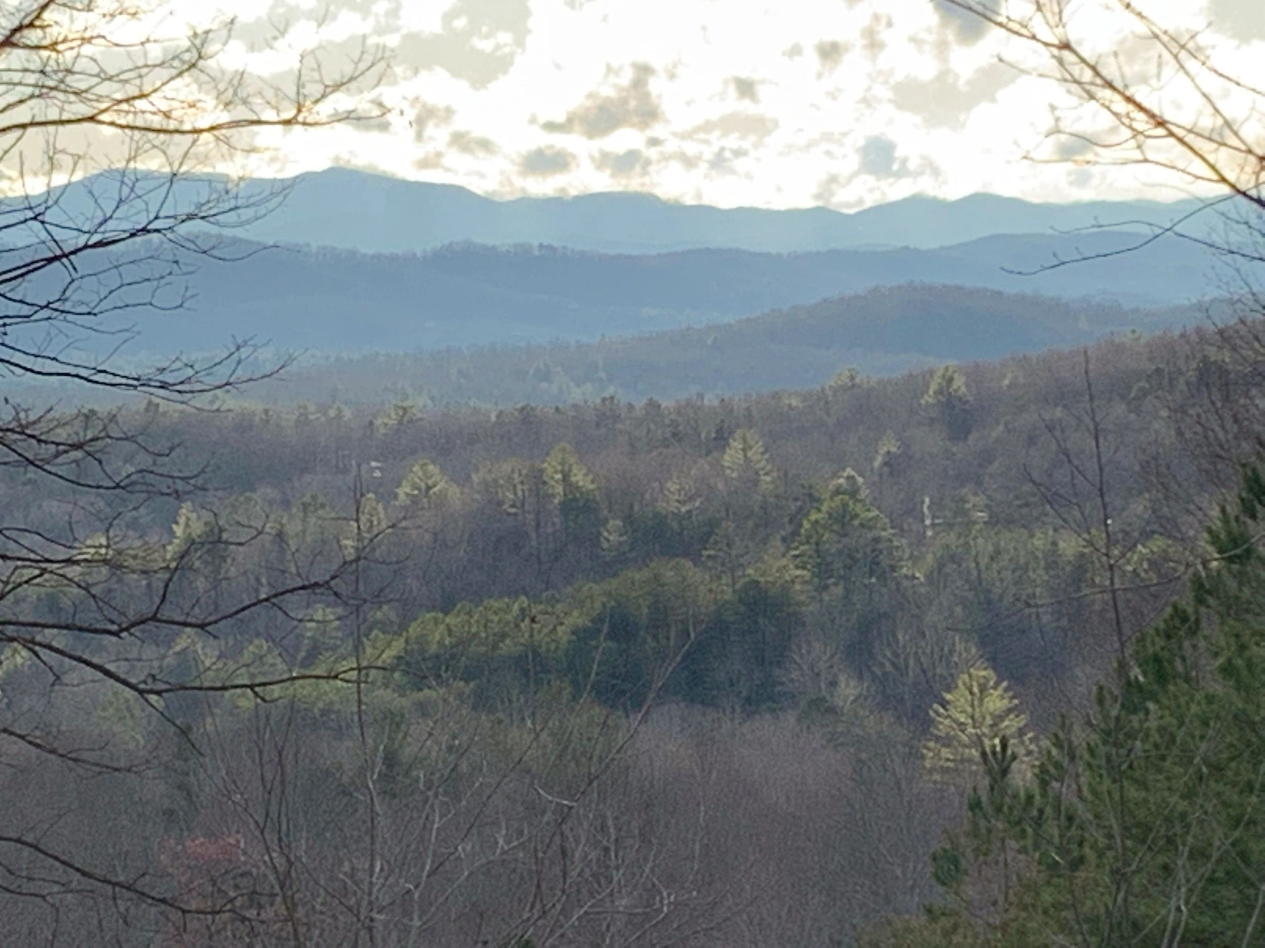 Long range, year round view of multiple mountain ranges