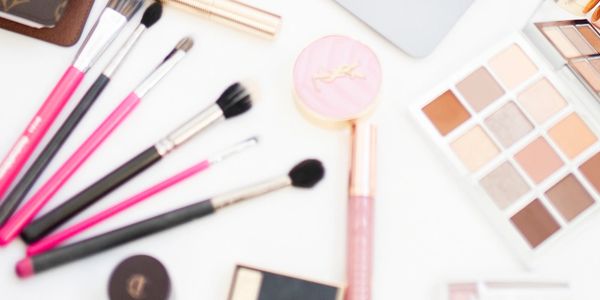 Makeup brushes and eyeshadow palette.