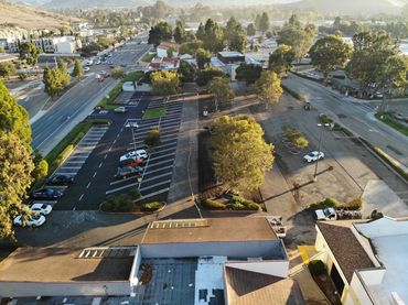 Aerial view of a commercial parking lot paved and striped by Integrous Paving.