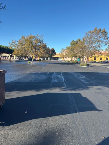 Repaired asphalt parking lot by Integrous Paving.