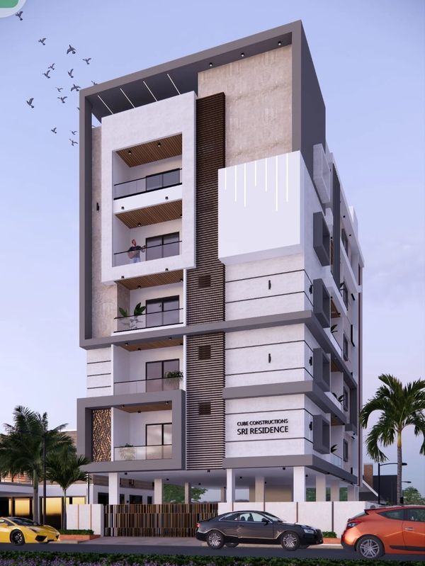 Modern multi-story residential building with balconies and sleek design.