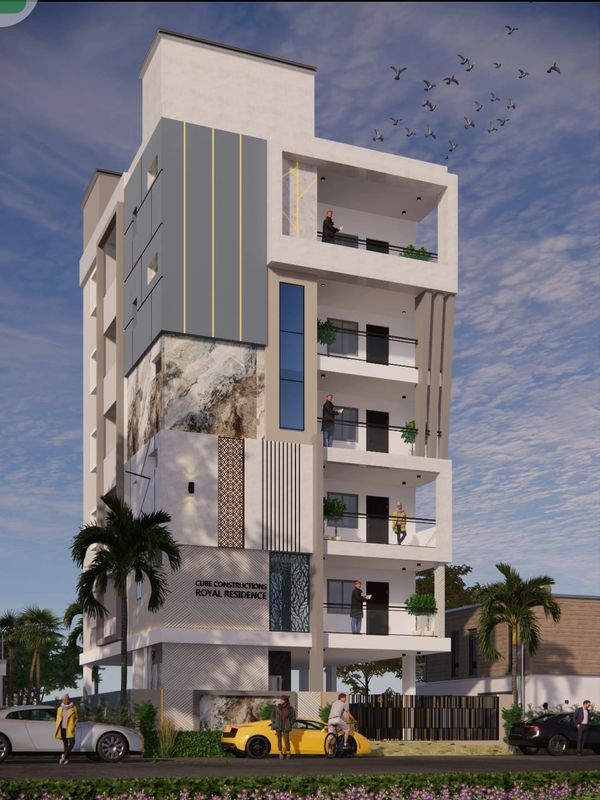 Modern multi-story residential building with balconies and people outside under a blue sky.