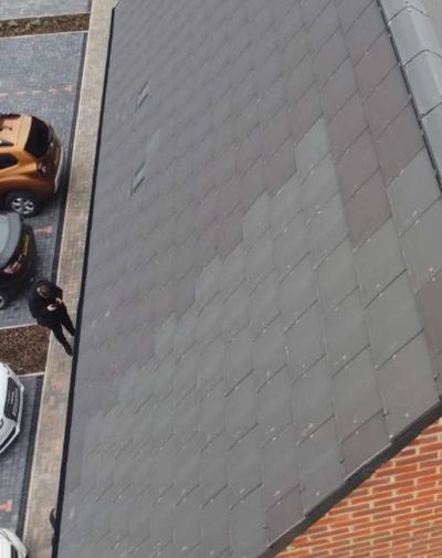 Snagging a roof by drone, spotting the tiles are different colours which will worsen as they age