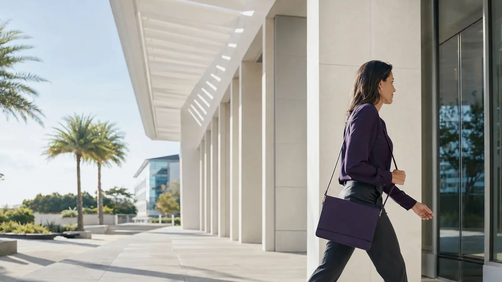 A Jacksonville professional commuting or arriving at work in natural coastal morning light.