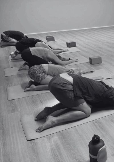 Yin Yoga class at Infuse Health Adamstown — floor-based long hold poses to release the body
