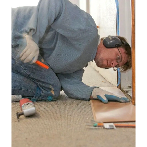 Jason Essig (Owner) working on putting down LVP in doorway