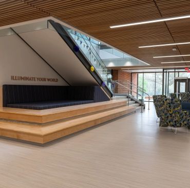 Modern lobby area with stairs and seating.
