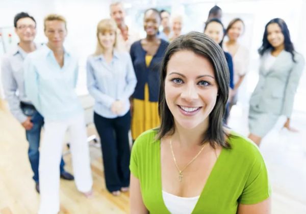 Business Woman with the Team in Office