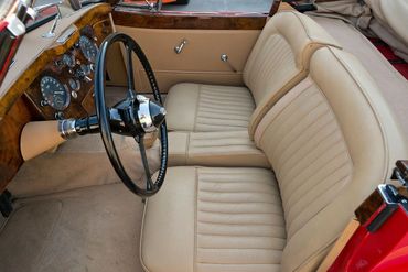 Finished in a stunning red over a Biscuit Connolly leather interior with a burled walnut trim.