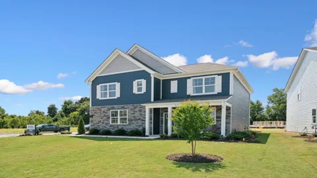 Newly renovated home painted a  Sherwin-Williams navy blue and high gloss super white paint trim
