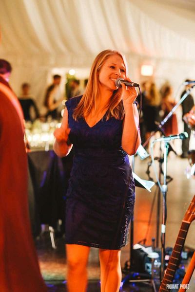 Kelly, MCing a wedding at Lake Pearl in Wrentham, MA. Photo by Piquant Photography: https://www.piqu