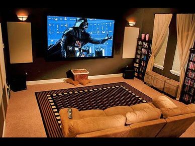 Cozy home theater with a large screen showing Darth Vader.