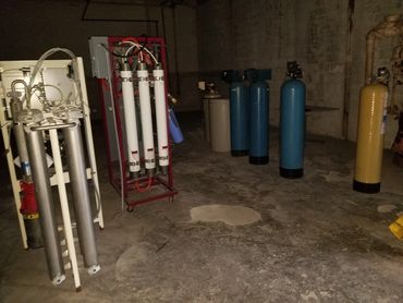 Assorted oxygen tanks and compressed gas cylinders prepped for pickup