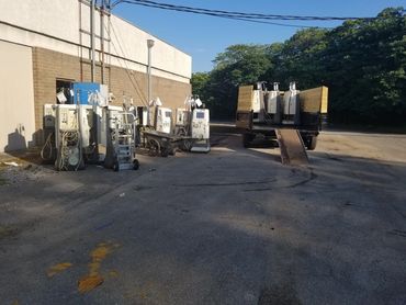 Outside staging area with medical and industrial junk before hauling