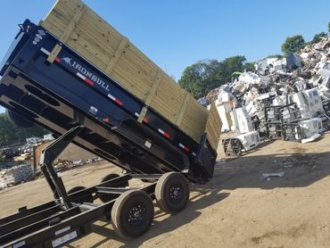 Dump trailer unloading scrap from a large warehouse job