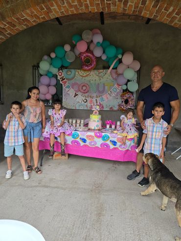 Birthday celebration with balloons and cake during Hill family gathering in Mexico