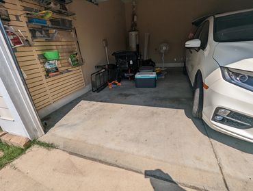 Garage cleanout items staged for pickup on Birmingham driveway