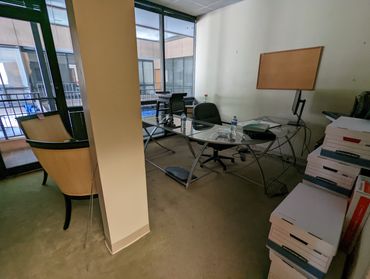 Boxes, chairs, and office equipment during Birmingham business cleanout