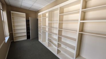 Cleared-out office shelves during a professional cleanout project